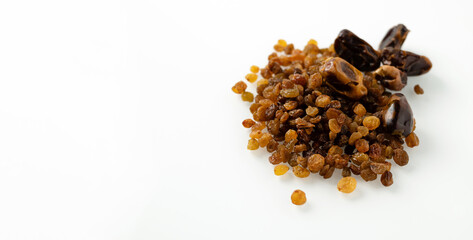 dry fruits of dates and raisins, on a white background, banner, space for text