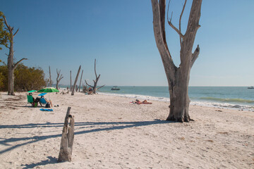 Leisure activities on Florida beach, sunbathing people at Lovers Key State Park Fort Myers
