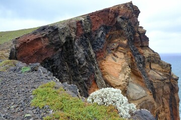 Ponta de Sao Lourenco (Saint Lawrence Peninsula) is the easternmost point on the Madeira map. A miracle of nature. Amazing colorful rocks. Silhouettes of people on trail. Madeira, Portugal