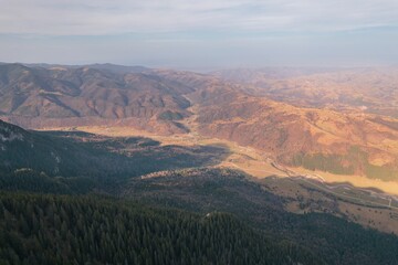 Fototapeta premium Backpack exploring sunny mountains. Travel and wanderlust concept. Amazing atmospheric moment. Mountaineers, hikers, and travelers can spend the day adventuring in the mountains