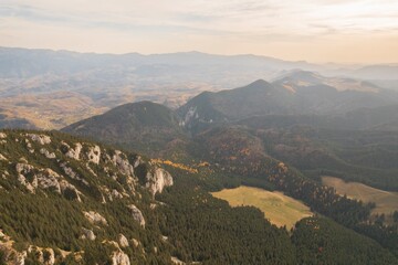 Fototapeta na wymiar Climbing Piatra Mica Peak may be difficult, but the view from the top is beautiful. Piatra Craiului National Park from Romania. People hiking mountain hills