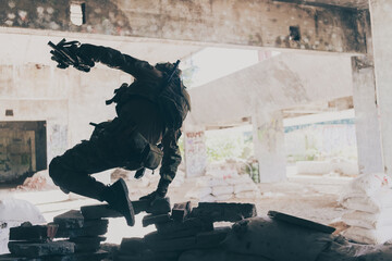 A bearded soldier in uniform of special forces in a dangerous military action in a dangerous enemy...