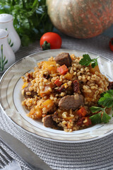 Beef with bulgur and vegetables such as pumpkin, carrots, onions and sun-dried tomatoes