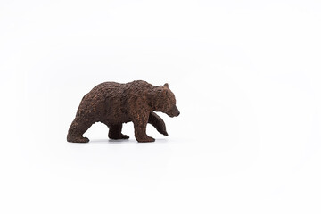 Toy animal figure brown bear on white. 