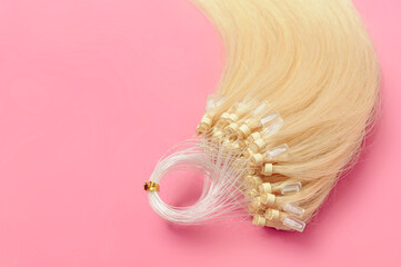Closeup of micro loop ring beads straight blonde human hair extensions 