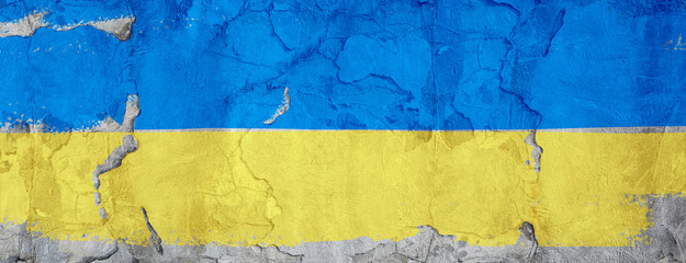 Yellow and blue Ukraine colours painted on textured concrete wall as a grungy background. Digital banner with copy space.