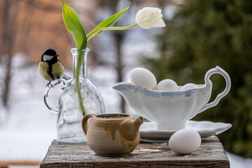still life with white flowers and a bird