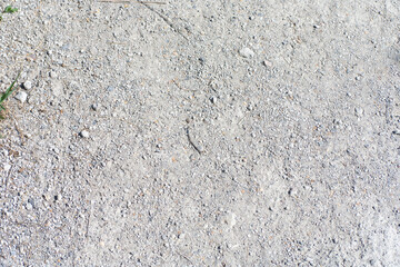small sand and gravel on path in park at dry sunny summer day