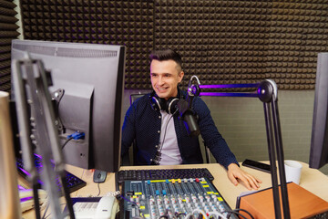 cheery radio in a shirt host broadcasts live reads news on computer screen.