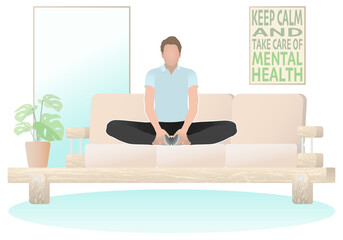 Fototapeta premium A man meditates in the baddha konasana pose in an apartment.