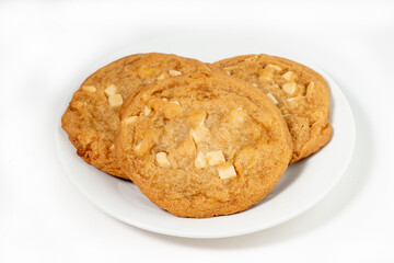 White chocolate chips cookies on a plate on a white background. Selective focus.