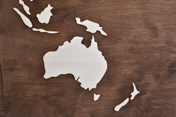 australia map outlines on wooden background