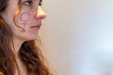 young girl with feminist symbol