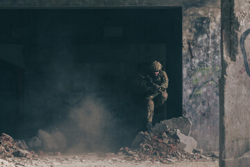 A bearded soldier in uniform of special forces in a dangerous military action in a dangerous enemy...