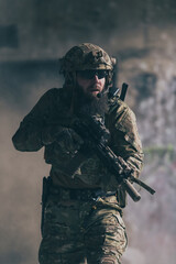 A bearded soldier in uniform of special forces in a dangerous military action in a dangerous enemy...
