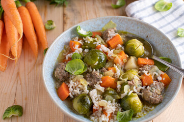 Vegetable soup or stew with brown rice and meatballs