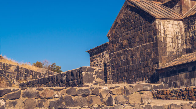 Closeup view of an old Sevanavank church in Sevan. Blue sky and bright autum colors on the sunny day. Ancient temple stock photography.