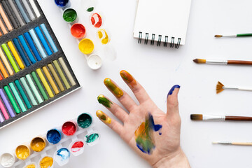 Naklejka premium Flat composition set of artistic tools. Brushes, paints, pencils, pastels for drawing. Place for text.