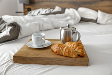 Bedroom interior and breakfast on bed 