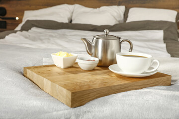 Fototapeta na wymiar Bedroom interior and breakfast on bed 