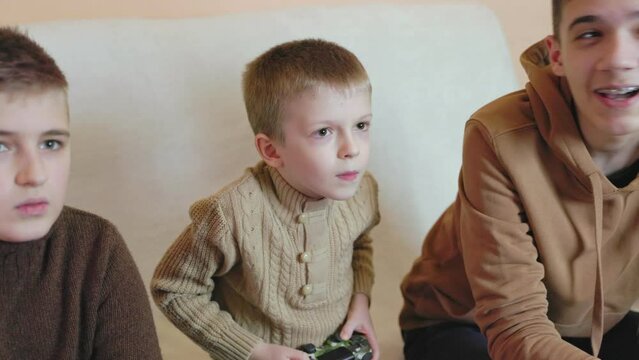 children playing on the console with joysticks in ruhs close-up