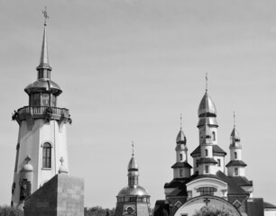 Christian church cross in high steeple tower for prayer
