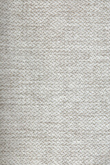 Knitted texture. Texture of jacquard fabric with gray pattern. Crochet mosaic pattern.