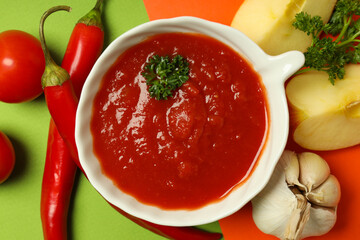Concept of tasty food with adjika, top view
