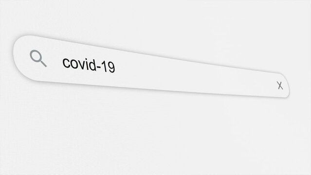 Covid 19 being typed in the search bar. Coronavirus. Global pandemic. Web browser. Typing. Screen. Close up