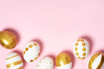 Hand-drawn easter eggs on pink pastel background. Many easter eggs flat lay background.