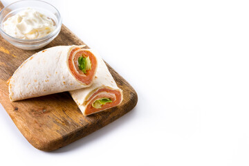 Salmon wrap sandwich roll with cheese and vegetables isolated on white background. Copy space