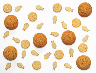 Collection of different types of biscuits  isolated on a white background.  Pattern from hard biscuits ,crackers ,oatmeal cookies .Top view
