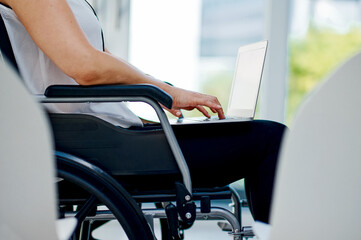 I have a disability but that wont stop me. Cropped shot of an unrecognizable businesswoman using...