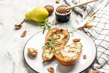 Pears baked with blue cheese, nuts and honey. French cuisine. Keto diet. Vegetarian lunch. banner,...