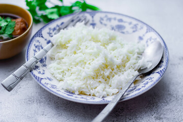 Steamed rice in an ancient plate and Stewed Eggs, Thai food and street food that are common in Thailand.