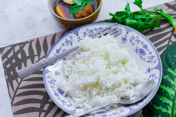 Steamed rice in an ancient plate and Stewed Eggs, Thai food and street food that are common in Thailand.