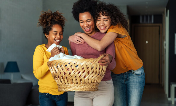 Happy Black Children Helping For Mother Do Household And Domestic Chores Together