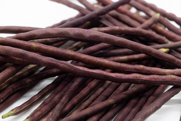 group of red color yardlong bean over on white background