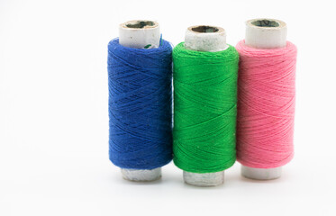 yarn or spool thread over on white background