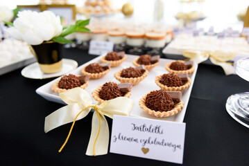 Chocolate tartlets on a candy bar at a wedding party