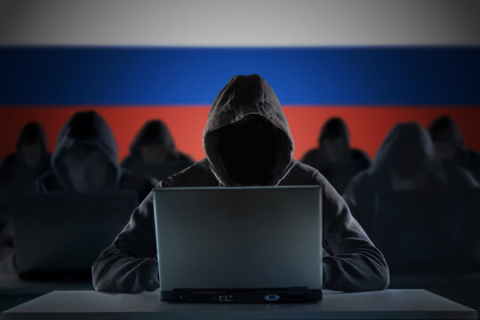 Many russian hackers in troll farm. Cyber crime and security concept.