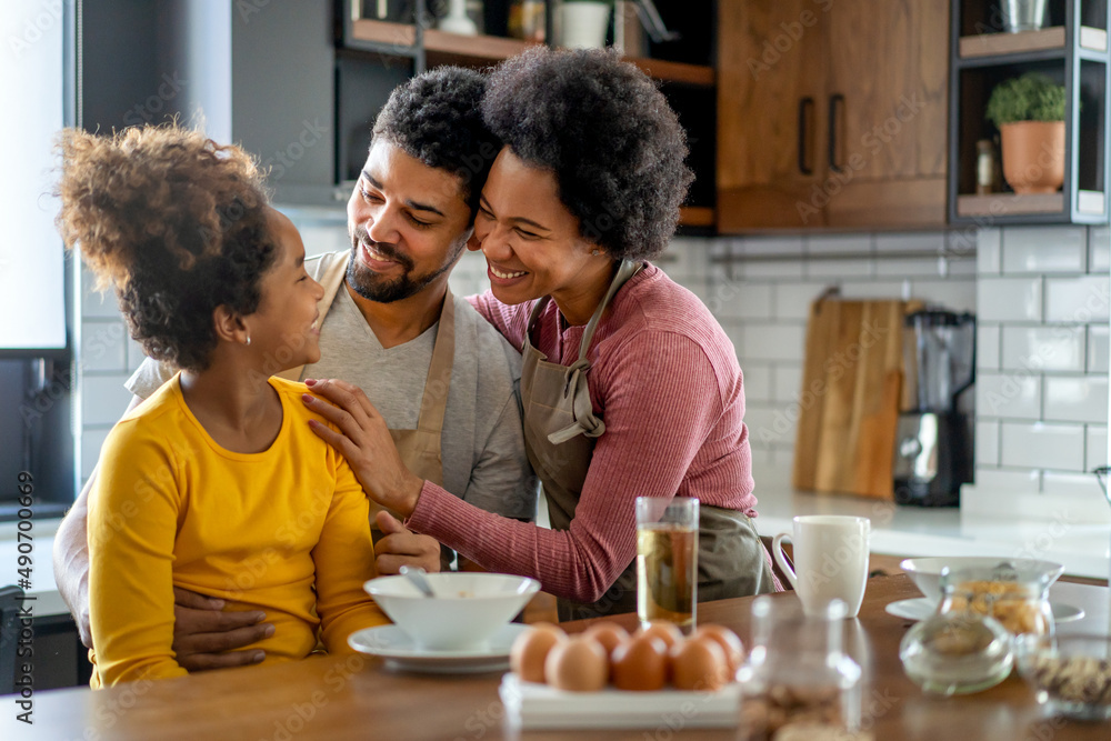 Poster happy african american family preparing healthy food together in kitchen