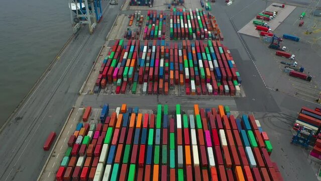 rone shot of modern industrial port of Hamburg with containers from top view or aerial view. It is an import and export cargo port where is a part of shipping dock