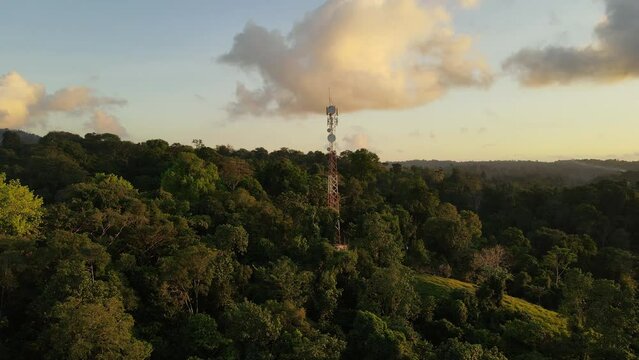 Aerial shot of a communications antenna in the jungle. Telecommunication tower