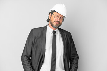 Young architect man with helmet over isolated background laughing