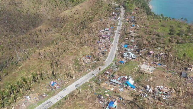 Coconut Trees And Houses Destroyed By Powerful Typhoon Odette In Philippines. - aerial