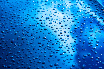 Naklejka na ściany i meble water drops on metal blue background