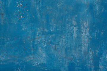 The dry golden curves are on a background of blue shabby wall moaning some shadows and beautiful ornaments