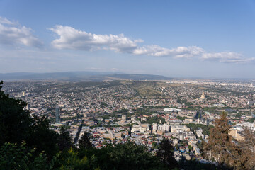 view of the city from the hill in the evening when the sea is quite dark there can be seen the roofs of buildings