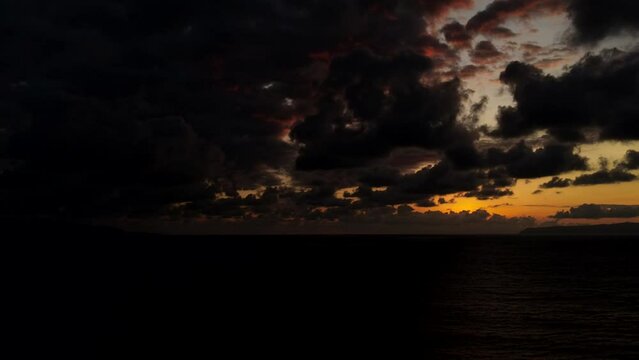 Day to night timelapse with ocean view. Hyper lapse shot of a sunset in Costa Rica. Lot of clouds are moving fast and waves are coming from pacific ocean. Pavones, surf area - Powered by Adobe